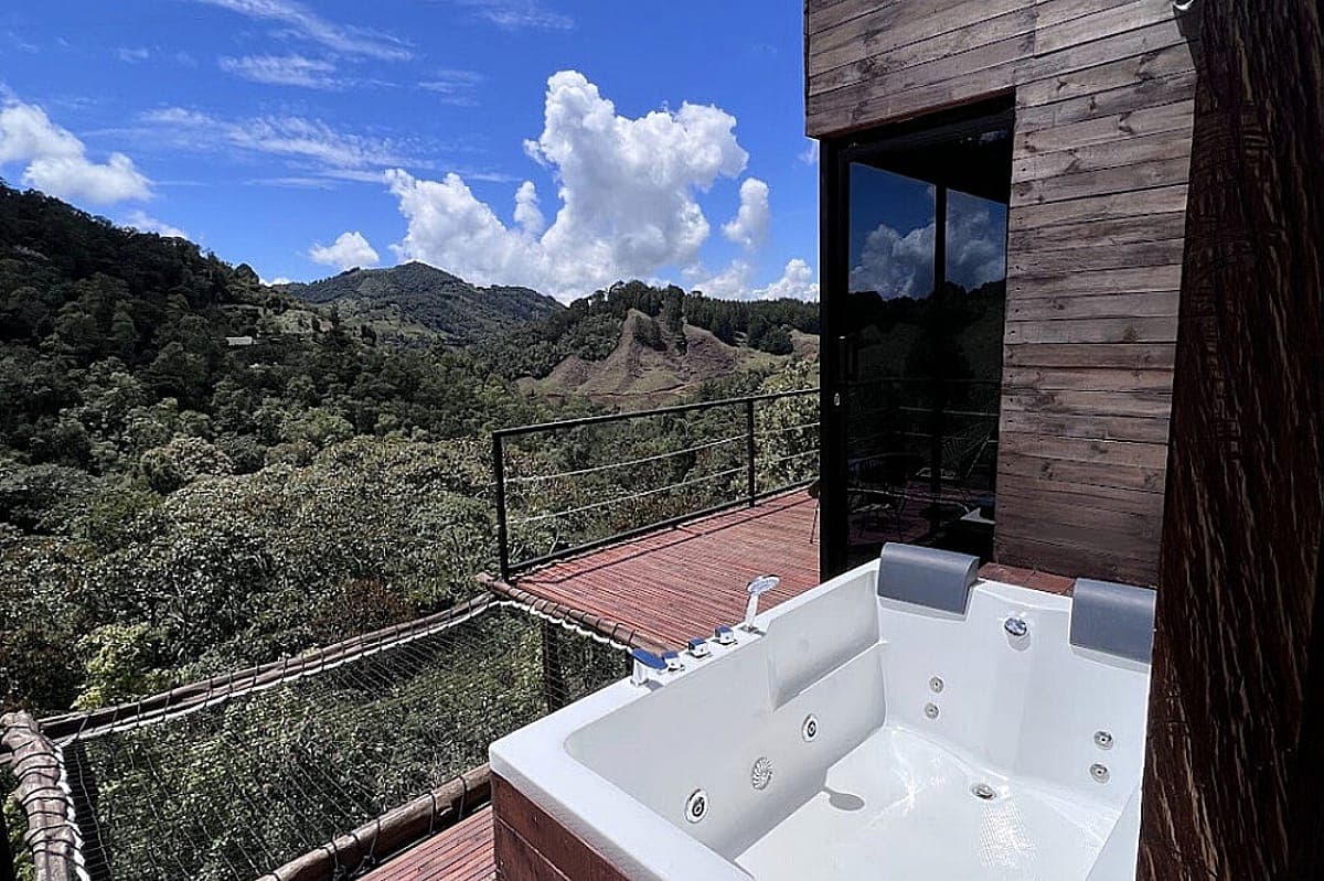 Warm wooden cabin interior with a double bed at Yaogara